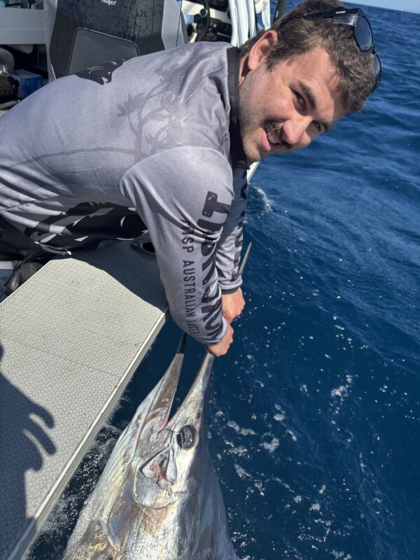 Kaleb Cooper with his first striped marlin